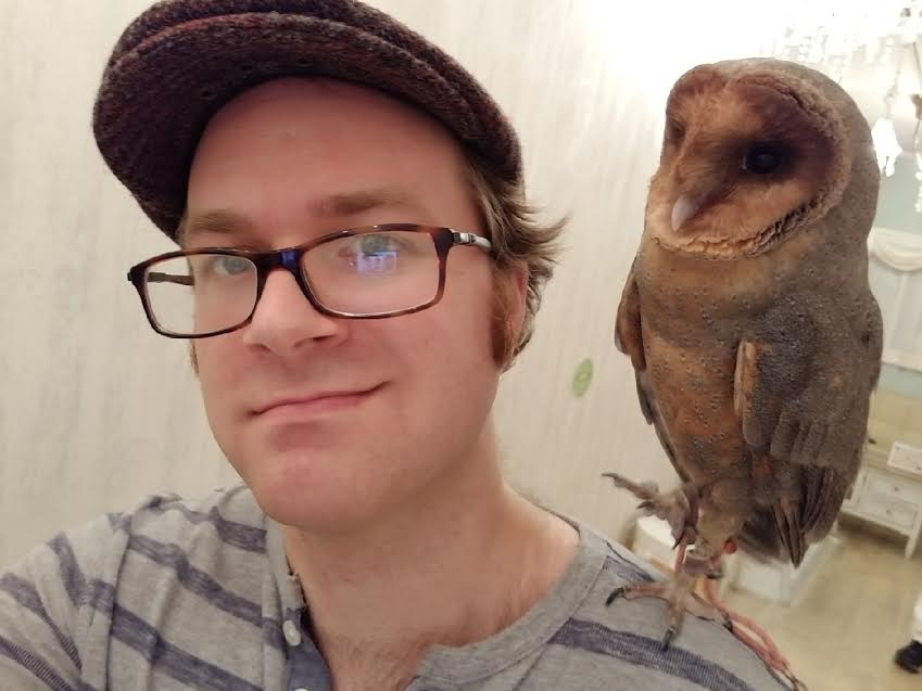 Master Crafter Kyle with an owl on his right shoulder.